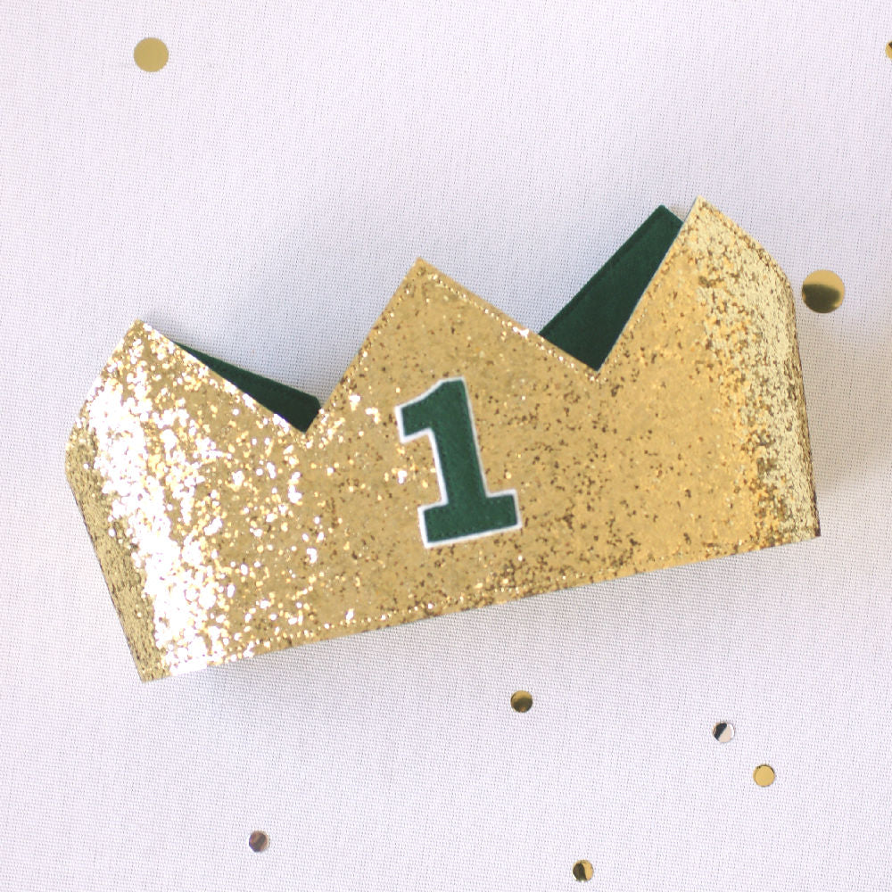 gold glitter birthday crown with dark green 1 on the front
